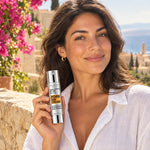 Woman holding Global Defense PDRN SPF 50+ bottle showing its size